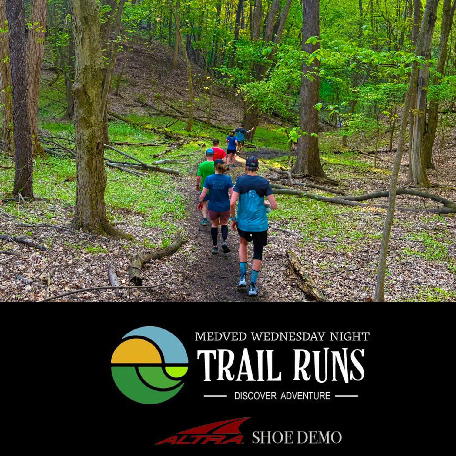 People trail running in the woods.
