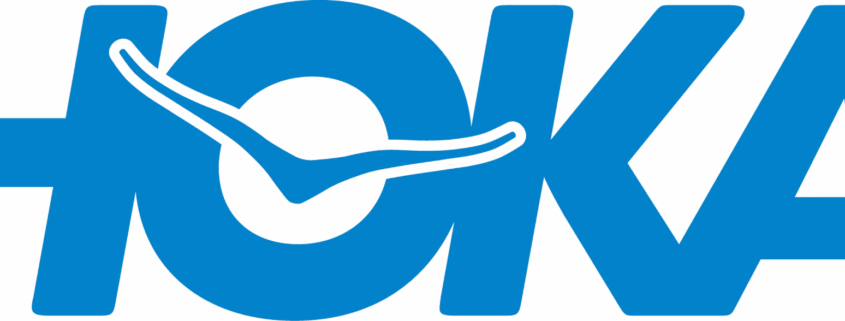A blue logo for "HOKA" with a stylized swoosh design integrated into the "O". The swoosh is white with a blue outline.