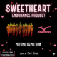 Promotional graphic for the "Sweetheart Endurance Project" featuring a Mizuno Demo Run. The image shows a silhouette of a group of runners in sunset colors against a black background with floating pink hearts. Text includes: Feb 14th @ 8 AM at Medved Running & Walking Outfitters.